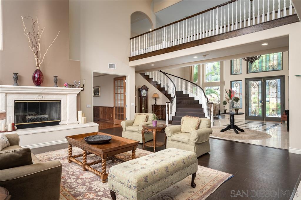 7302 Vista Rancho Court Rancho Santa Fe, CA 92091 - Photo 9 of 22 a living room with fireplace furniture and a large window