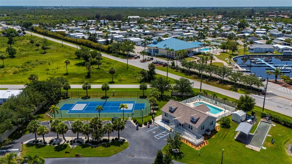 24604 Rio Villa Lakes Circle Punta Gorda, FL 33950 - Photo 19 of 28 an aerial view of residential houses with outdoor space and parking