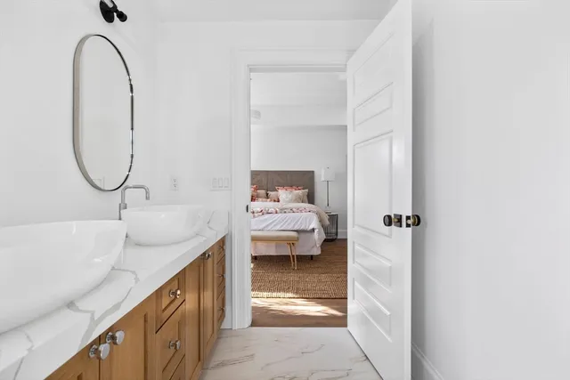 a en suite bathroom with a sink and a mirror