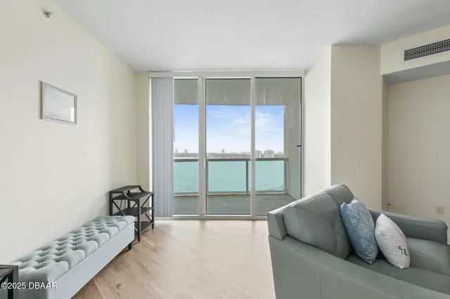 a room with furniture and wooden floor