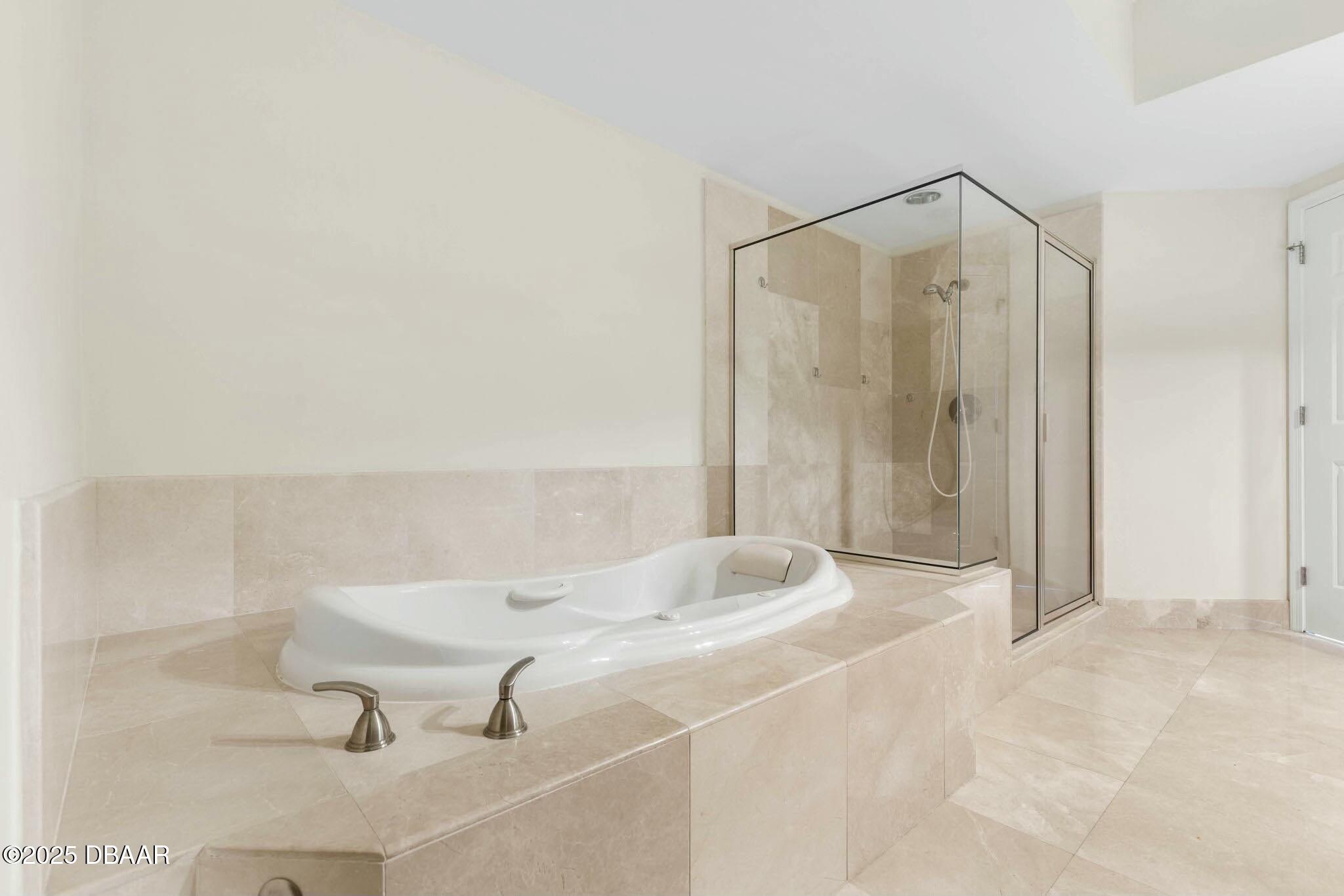 231 Riverside Drive, Unit 1104 Holly Hill, FL 32117 - Photo 36 of 77 a bathroom with a shower and a sink