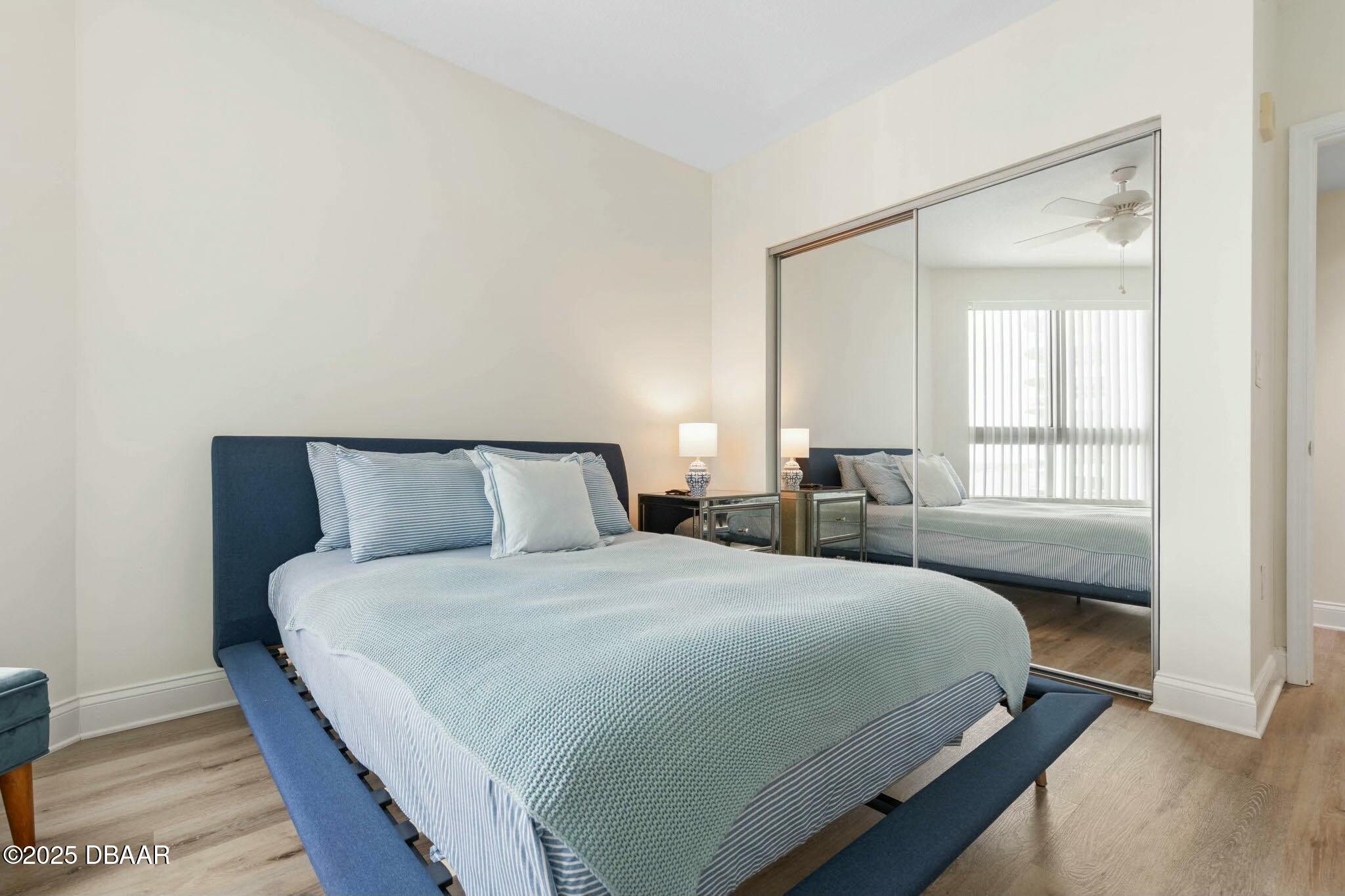 231 Riverside Drive, Unit 1104 Holly Hill, FL 32117 - Photo 39 of 77 a bedroom with a bed and a window