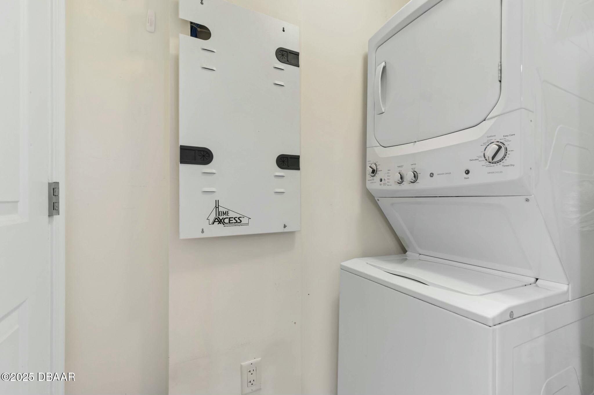 231 Riverside Drive, Unit 1104 Holly Hill, FL 32117 - Photo 43 of 77 a utility room with dryer and washer