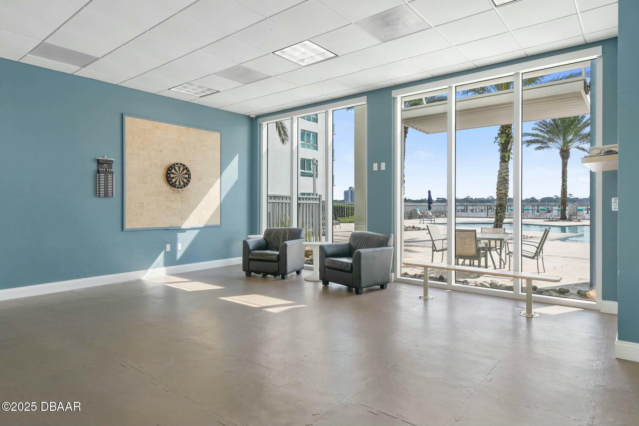231 Riverside Drive, Unit 1104 Holly Hill, FL 32117 - Photo 57 of 77 a living room with furniture and a large window
