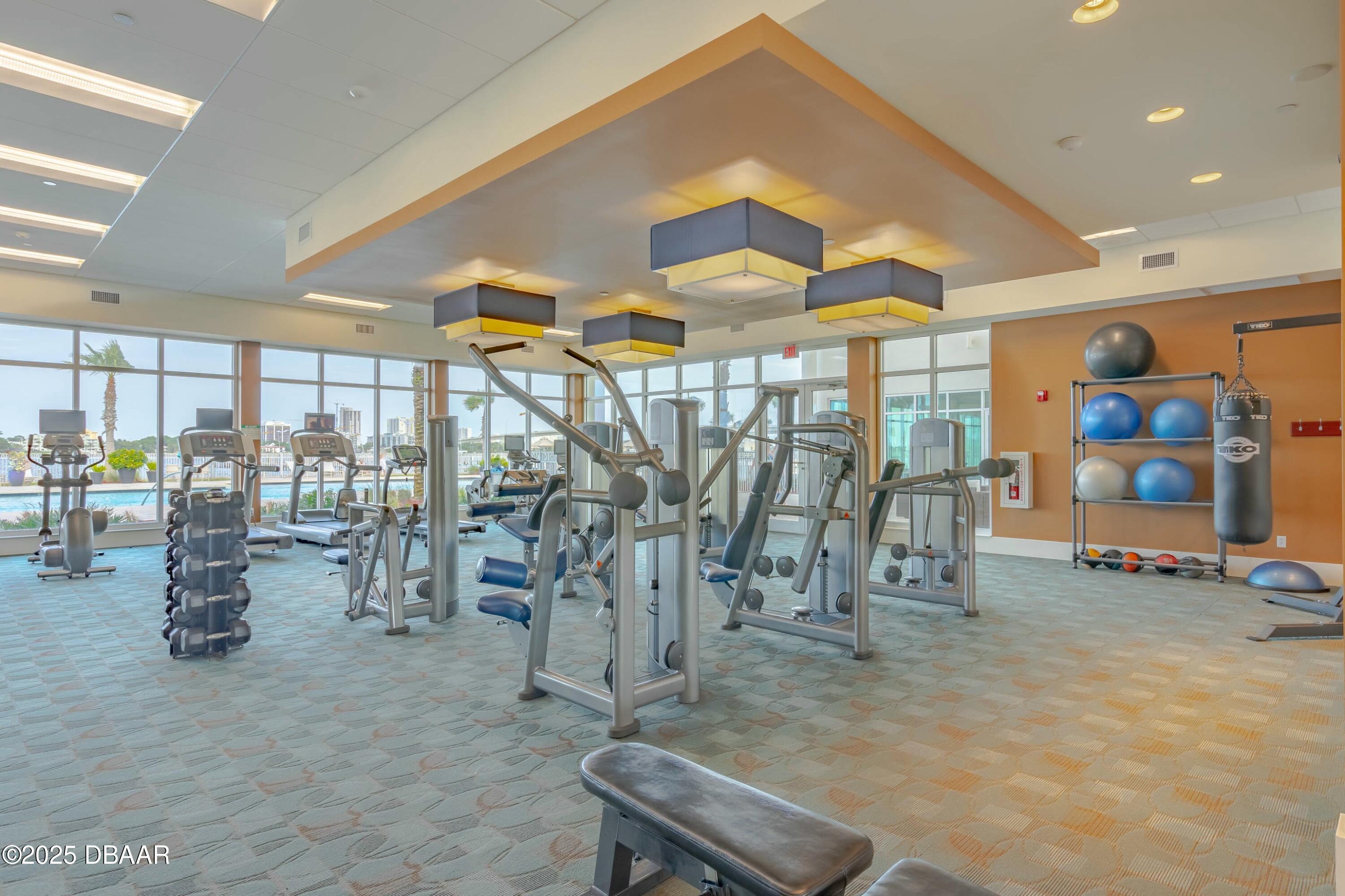 231 Riverside Drive, Unit 1104 Holly Hill, FL 32117 - Photo 66 of 77 a view of a room with gym equipment