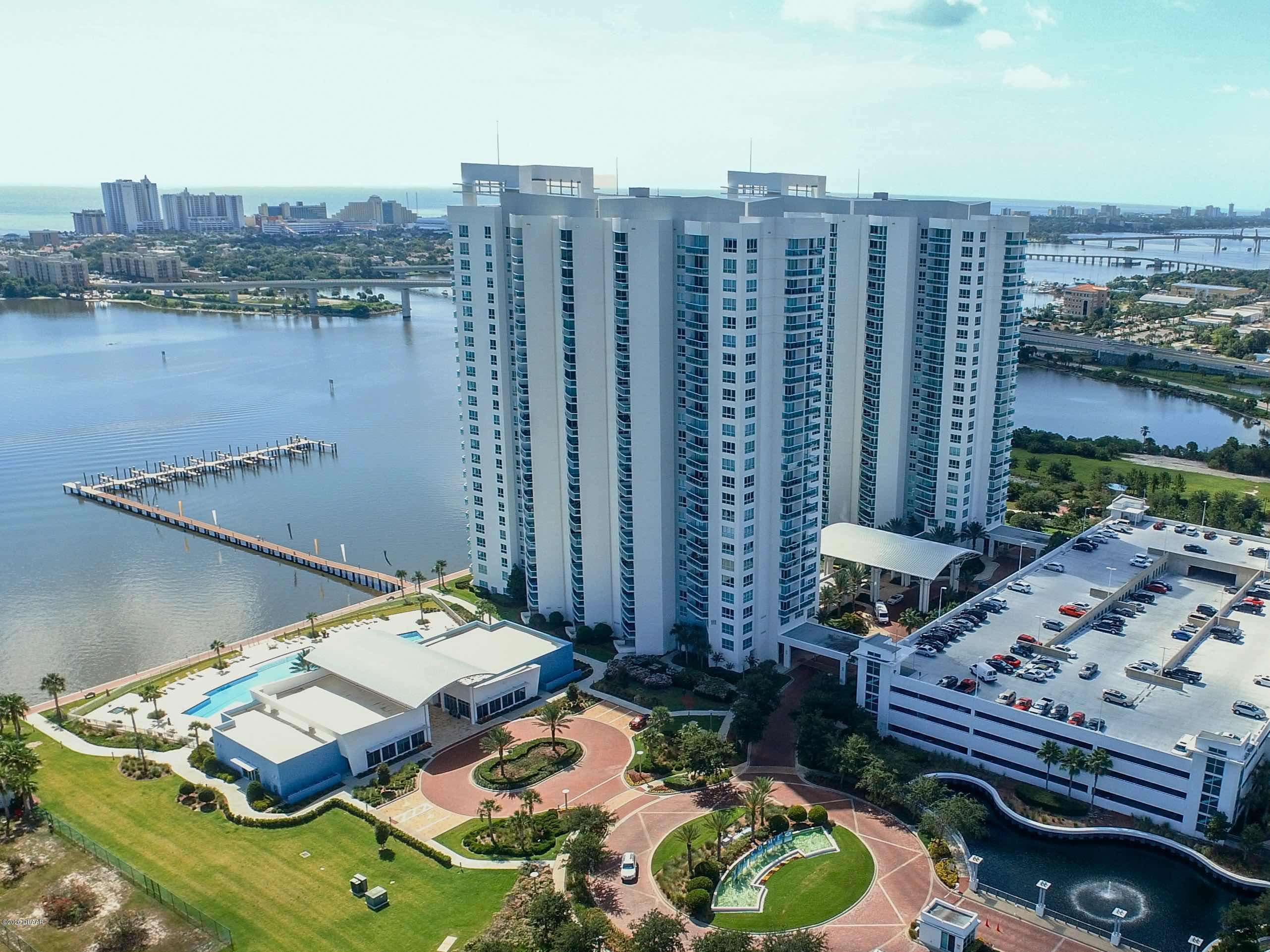 231 Riverside Drive, Unit 1104 Holly Hill, FL 32117 - Photo 77 of 77 a view of a balcony with chairs and a table