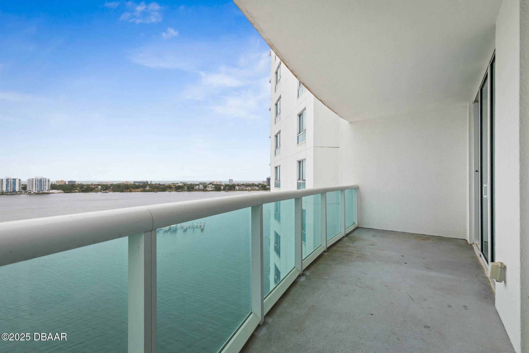 231 Riverside Drive, Unit 1104 Holly Hill, FL 32117 - Photo 10 of 77 a view of balcony with outdoor space and lake view
