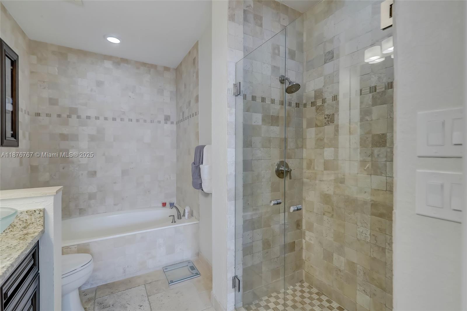 2039 Oceanwalk Lane, Unit 401 Pompano Beach, FL 33062 - Photo 11 of 12 a bathroom with a shower