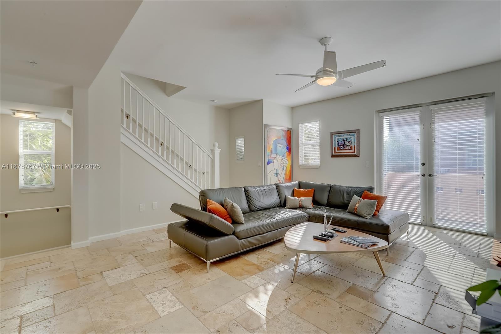 2039 Oceanwalk Lane, Unit 401 Pompano Beach, FL 33062 - Photo 7 of 12 a living room with furniture and a rug