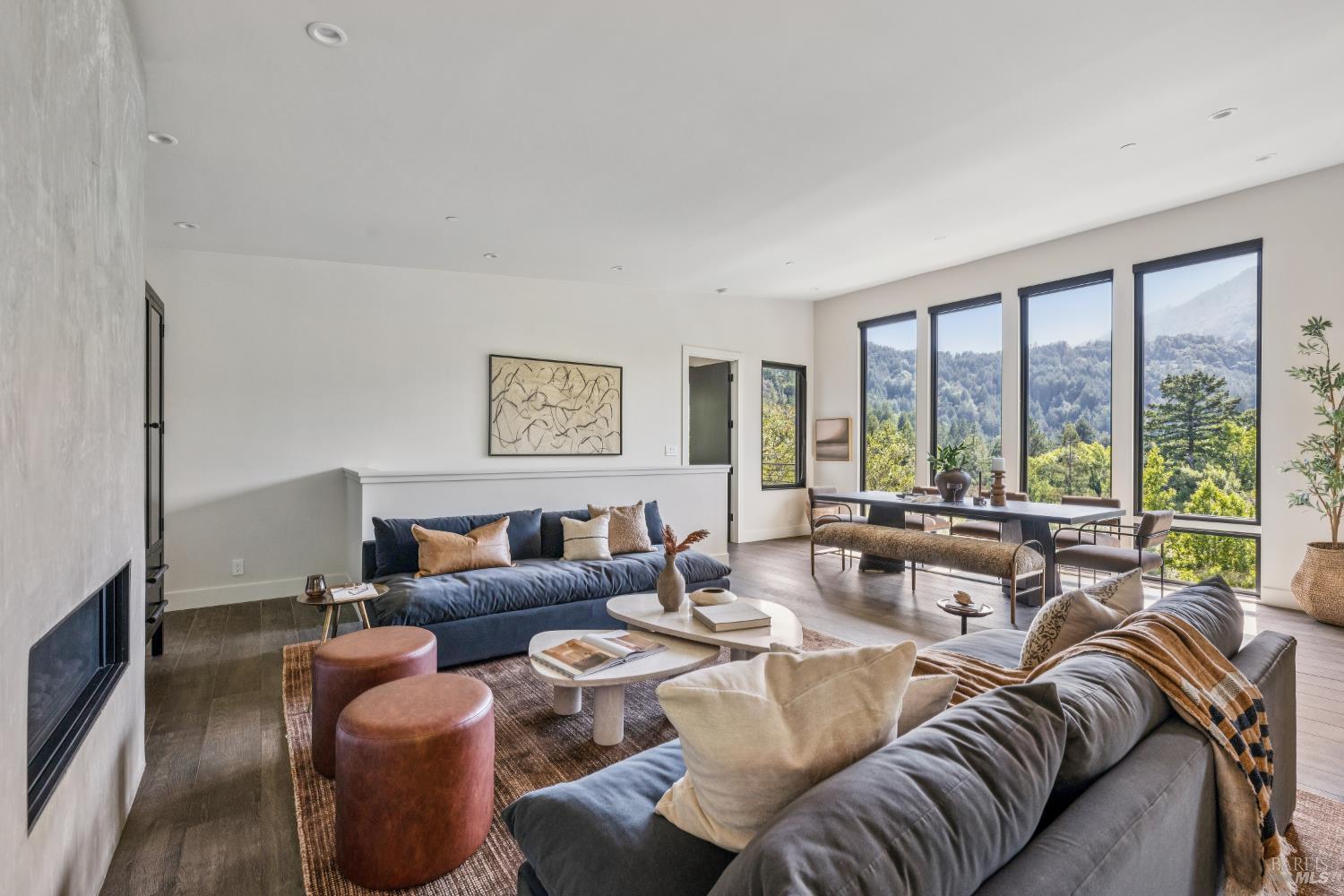 56 Millard Road Larkspur, CA 94939 - Photo 12 of 74 a living room with furniture large windows and wooden floor