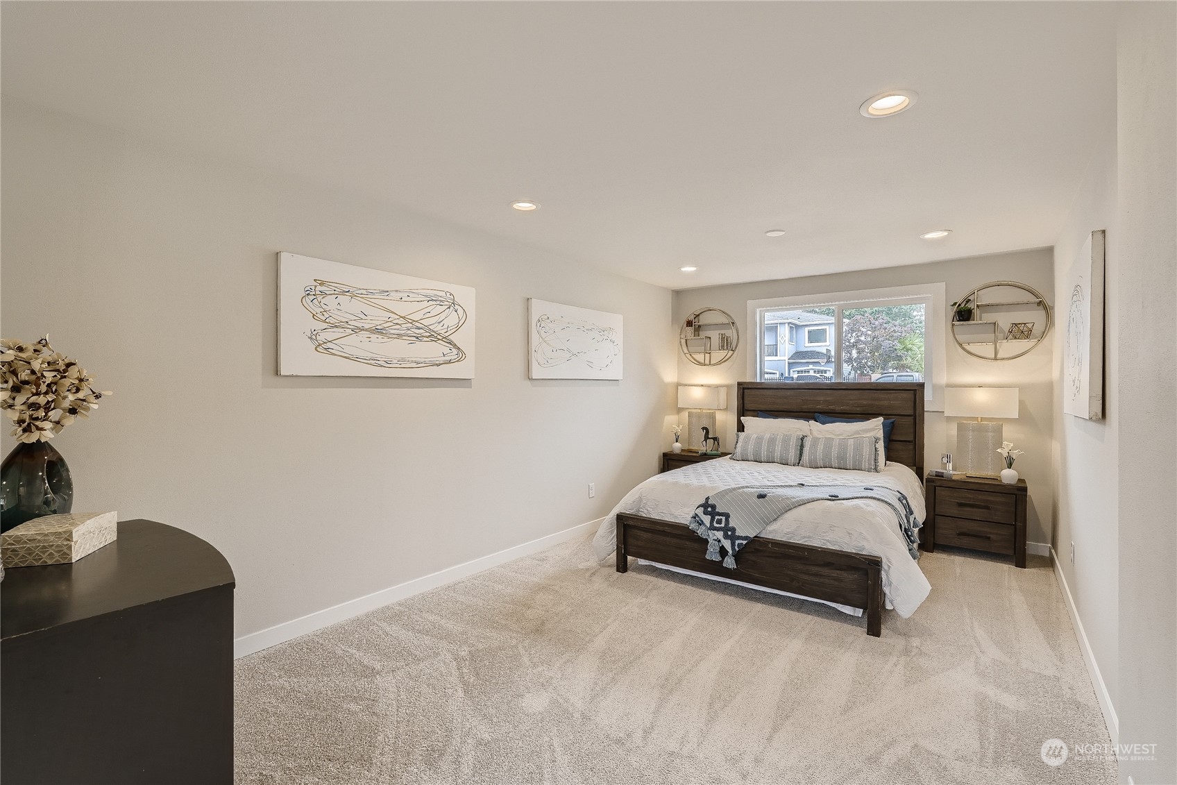 5004 Northeast 7th Place Renton, WA 98059 - Photo 16 of 28 a spacious bedroom with a bed and a couch