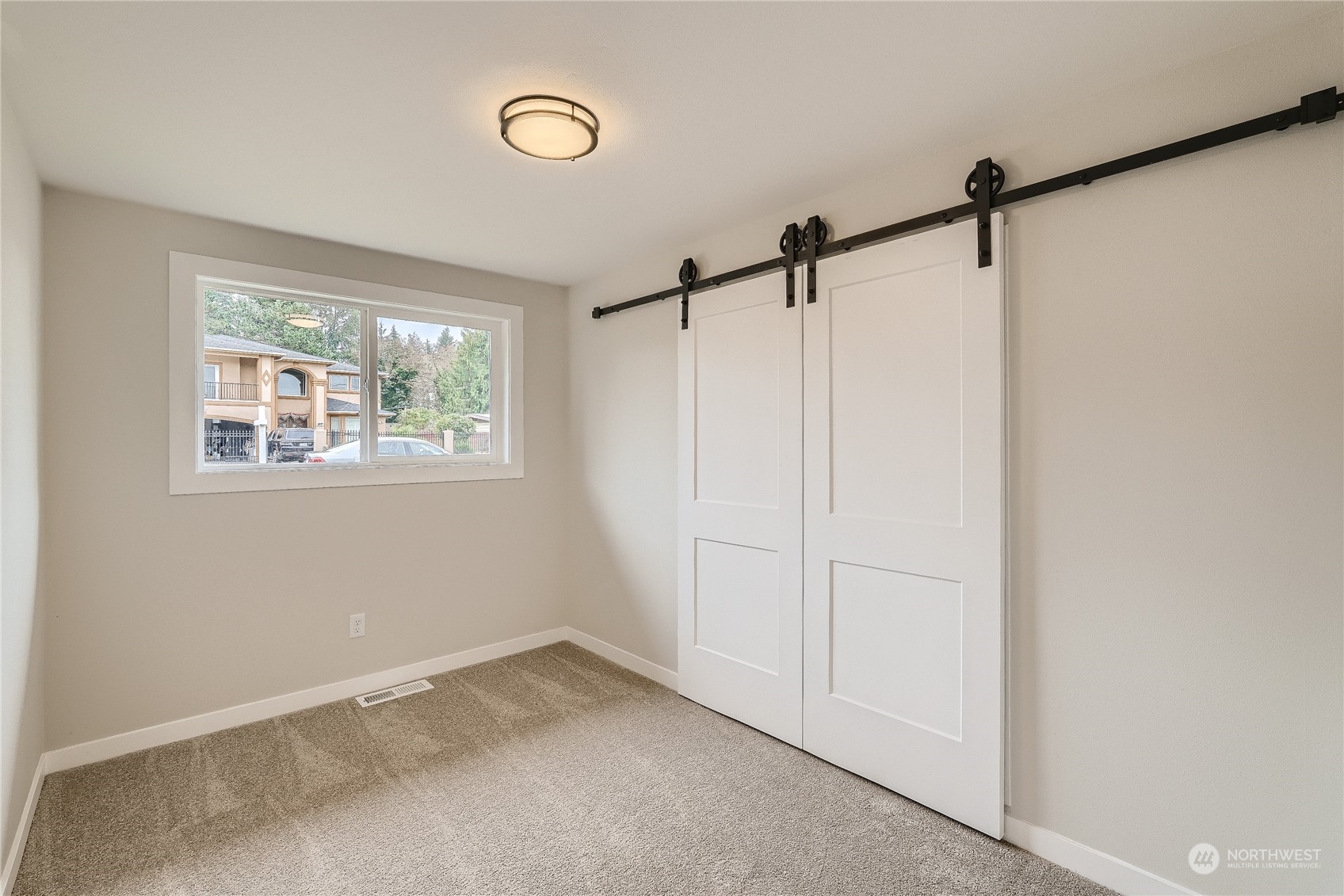 5004 Northeast 7th Place Renton, WA 98059 - Photo 20 of 28 a view of a room with a window and closet