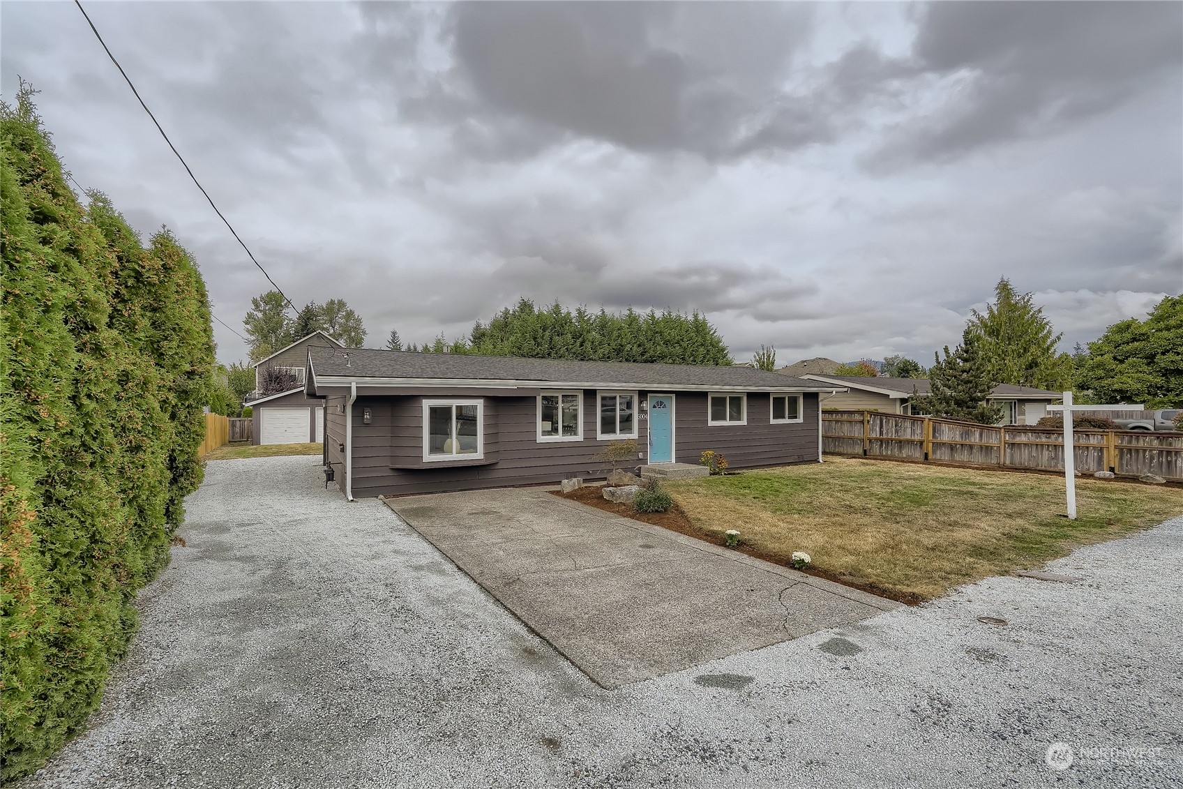 5004 Northeast 7th Place Renton, WA 98059 - Photo 2 of 28 front view of a house with a yard