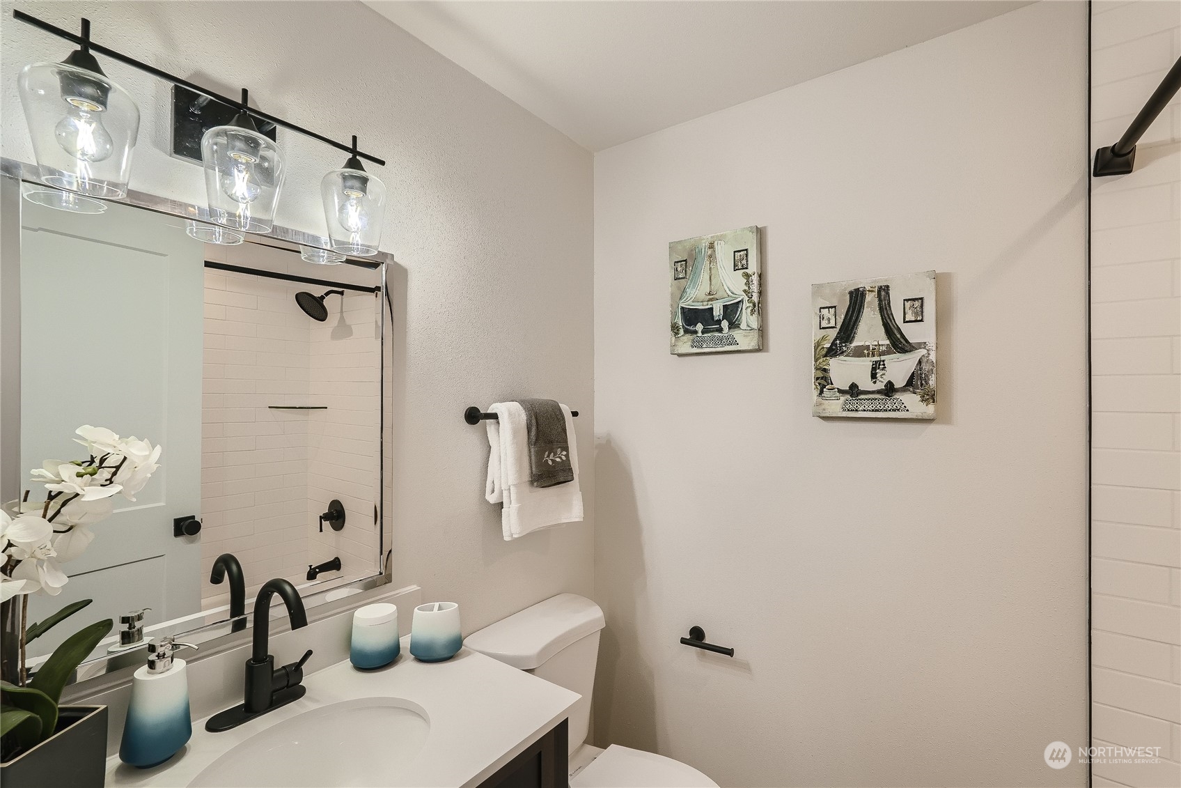 5004 Northeast 7th Place Renton, WA 98059 - Photo 22 of 28 a bathroom with a toilet a sink and mirror