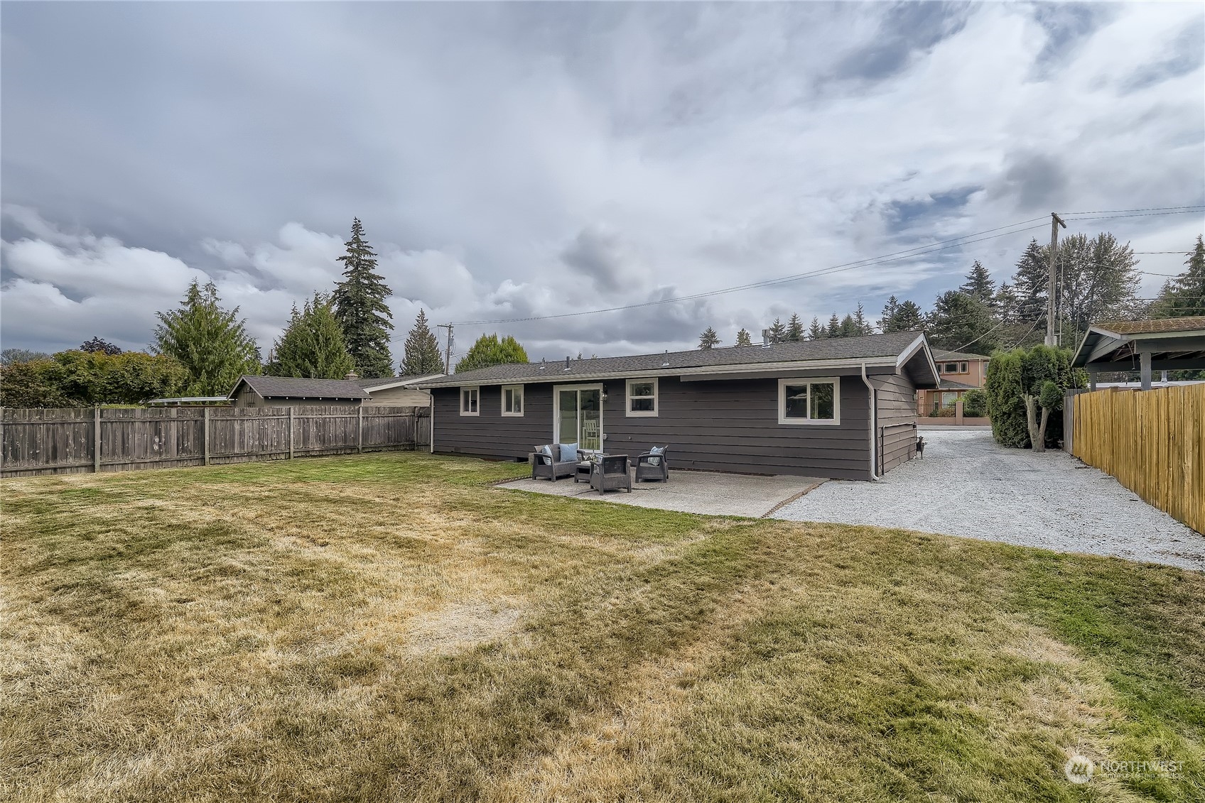5004 Northeast 7th Place Renton, WA 98059 - Photo 25 of 28 a view of a house with backyard and sitting area
