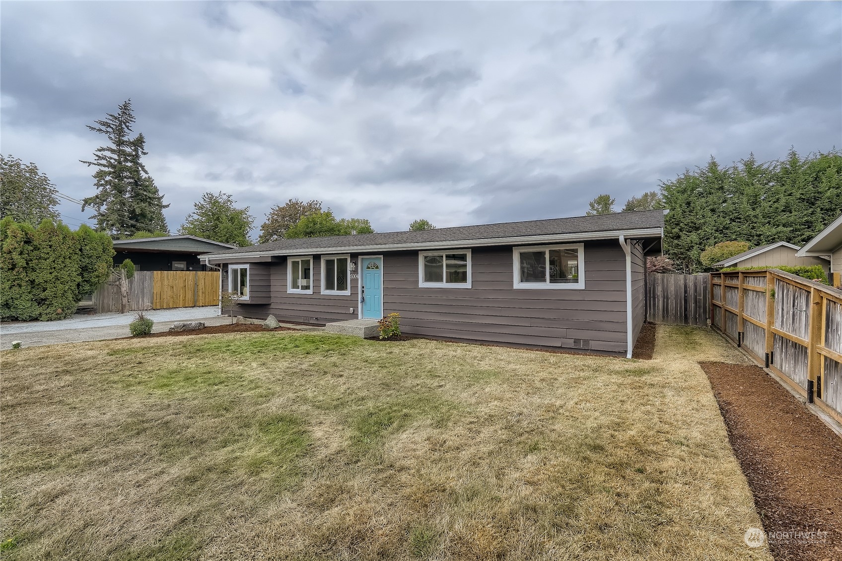 5004 Northeast 7th Place Renton, WA 98059 - Photo 3 of 28 front view of a house with a yard