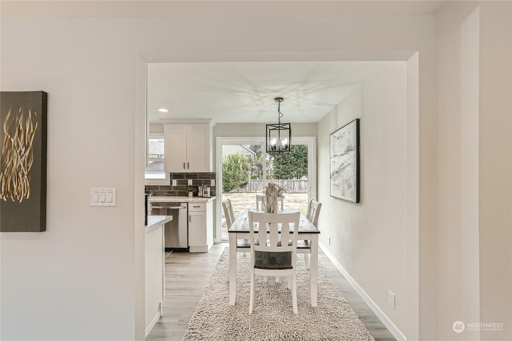 5004 Northeast 7th Place Renton, WA 98059 - Photo 8 of 28 a kitchen with a table and chairs