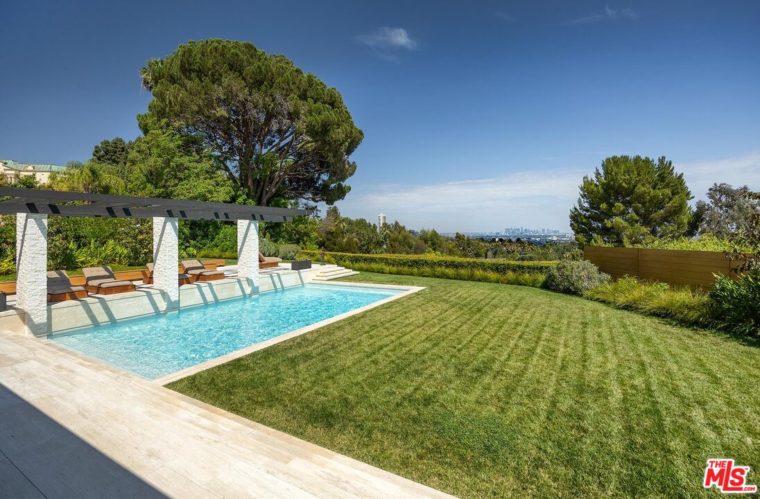 984 North Alpine Drive Beverly Hills, CA 90210 - Photo 11 of 25 swimming pool view with a garden space