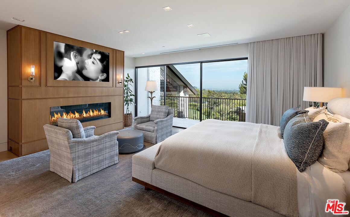 984 North Alpine Drive Beverly Hills, CA 90210 - Photo 17 of 25 a bedroom with bed and a large window