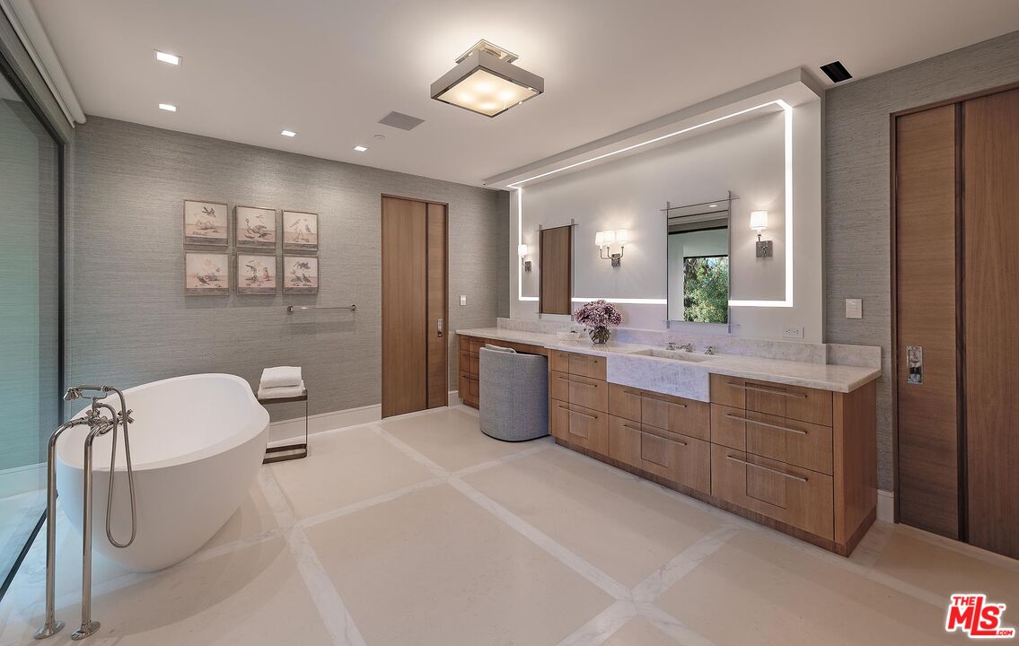 984 North Alpine Drive Beverly Hills, CA 90210 - Photo 18 of 25 a bathroom with a double vanity sink a toilet and mirror