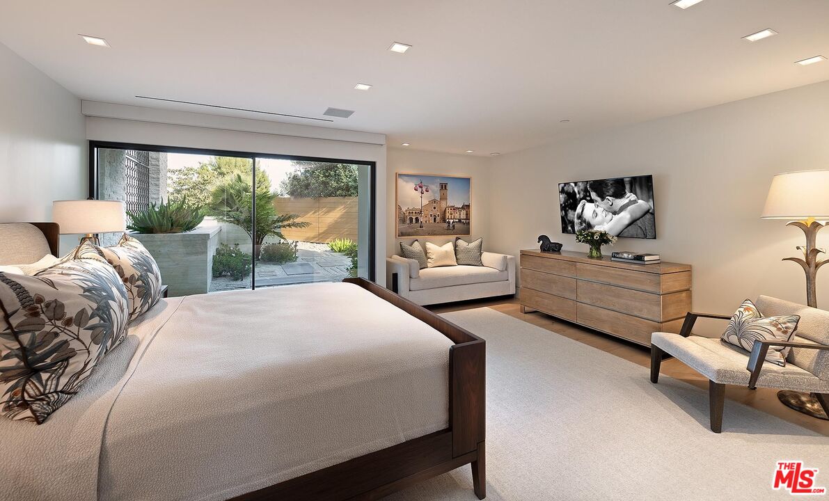 984 North Alpine Drive Beverly Hills, CA 90210 - Photo 20 of 25 a bedroom with two beds and large window