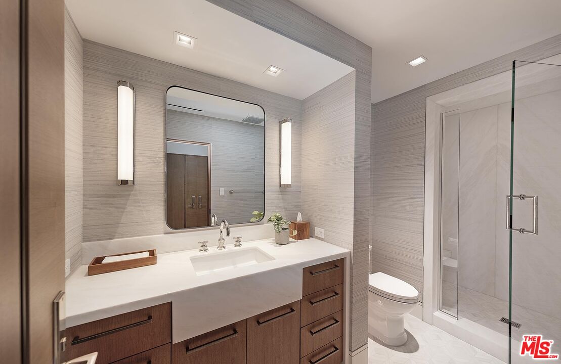 984 North Alpine Drive Beverly Hills, CA 90210 - Photo 21 of 25 a bathroom with a sink a toilet and shower