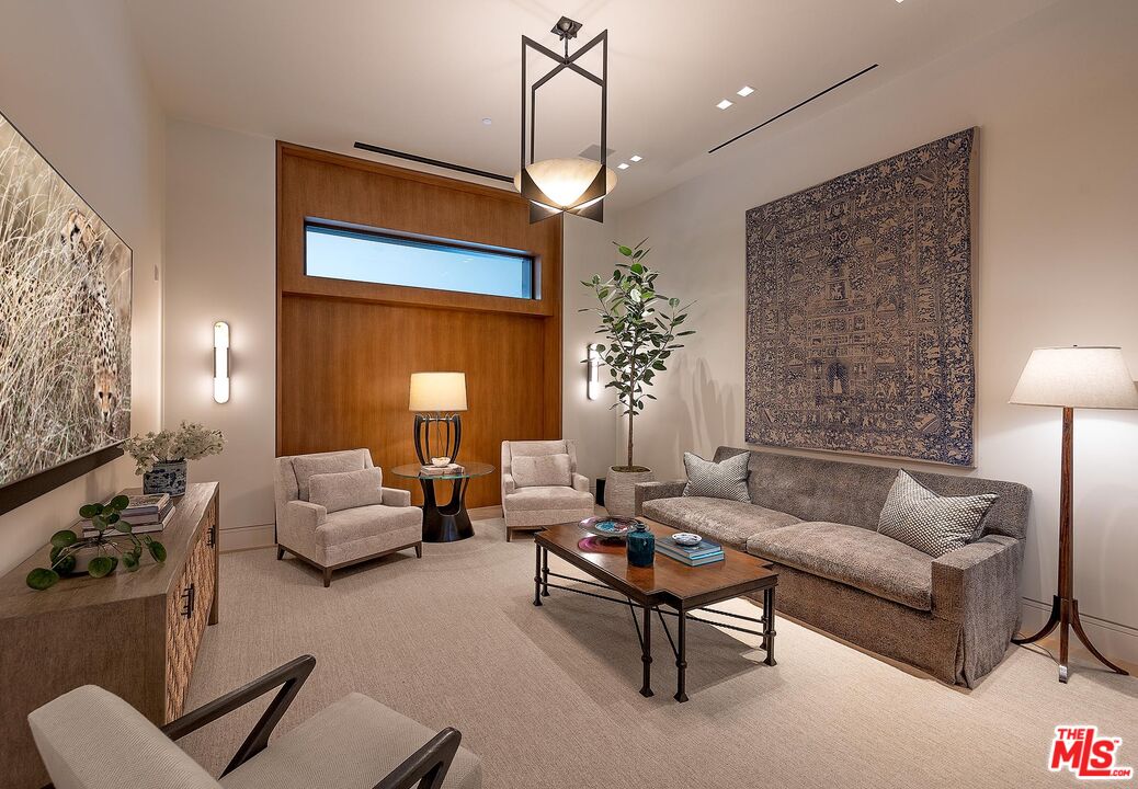 984 North Alpine Drive Beverly Hills, CA 90210 - Photo 5 of 25 a living room with furniture a lamp and a chandelier