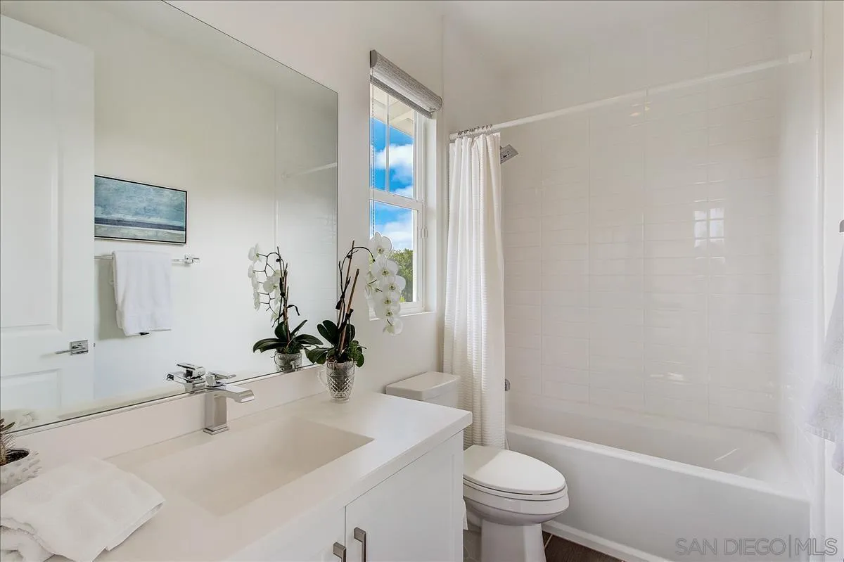 656 Jocelyn Way Encinitas, CA 92024 - Photo 14 of 35 a bathroom with a sink toilet and shower