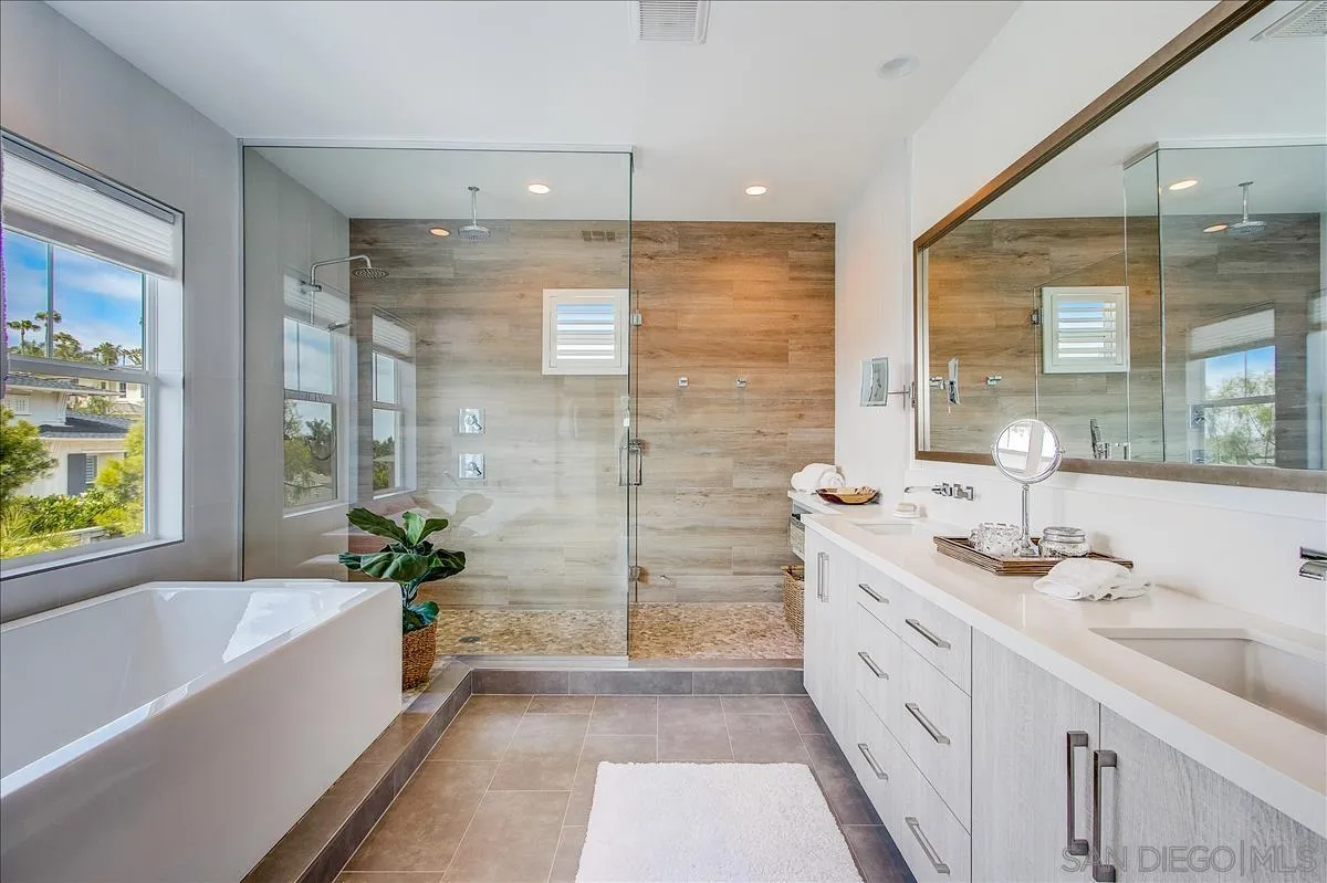 656 Jocelyn Way Encinitas, CA 92024 - Photo 19 of 35 a bathroom with a tub sink and mirror