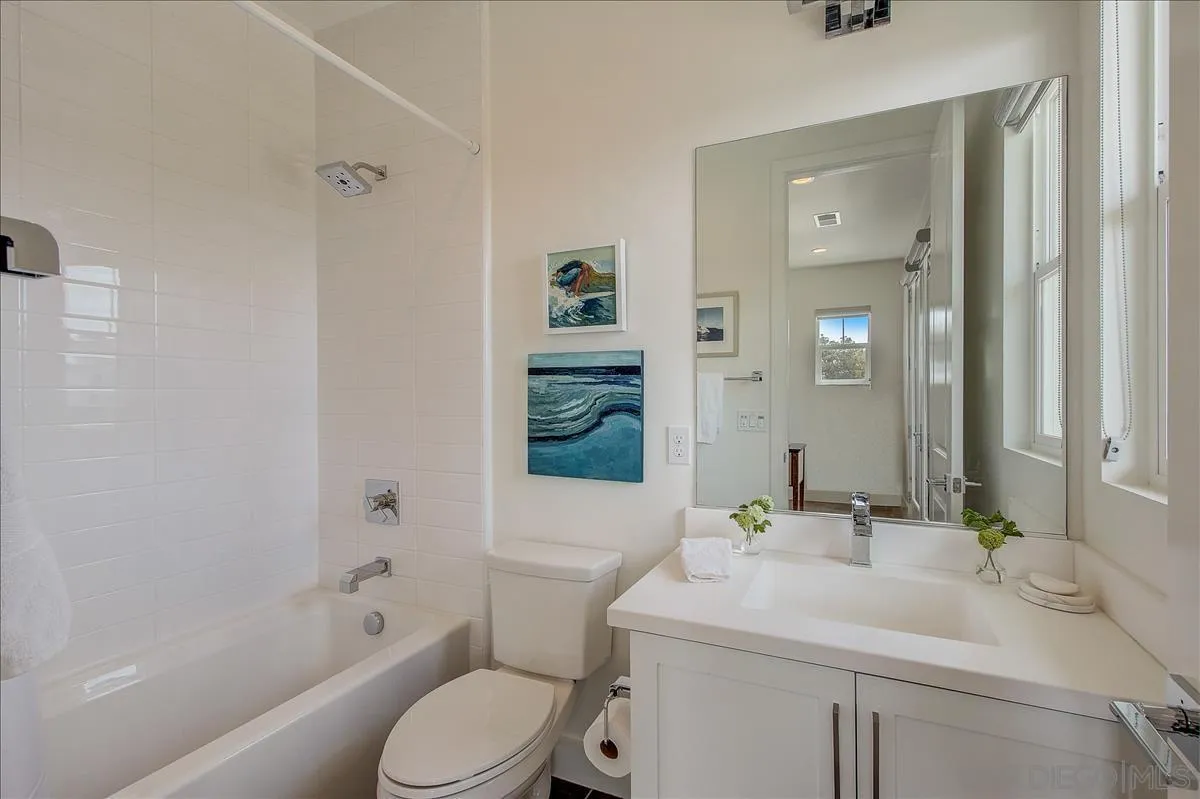 656 Jocelyn Way Encinitas, CA 92024 - Photo 21 of 35 a bathroom with a sink toilet vanity and shower