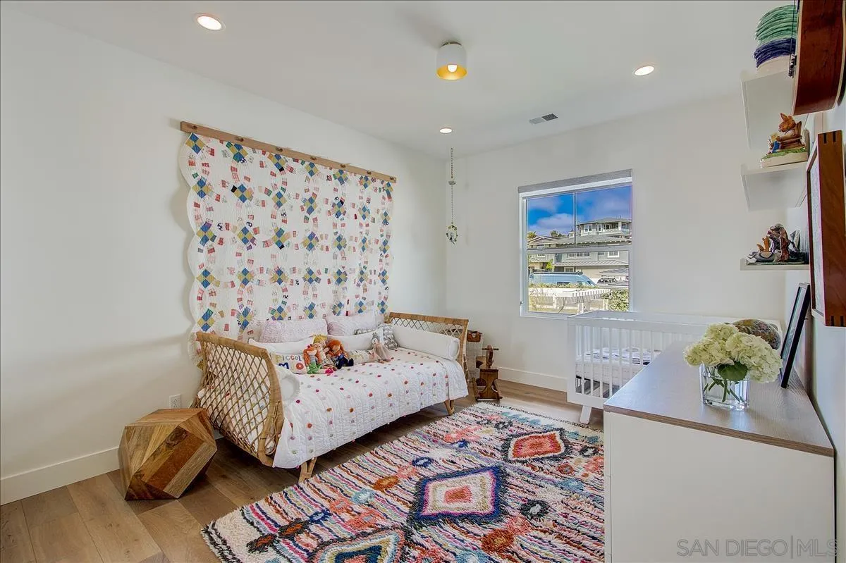 656 Jocelyn Way Encinitas, CA 92024 - Photo 23 of 35 a living room with furniture and flowers