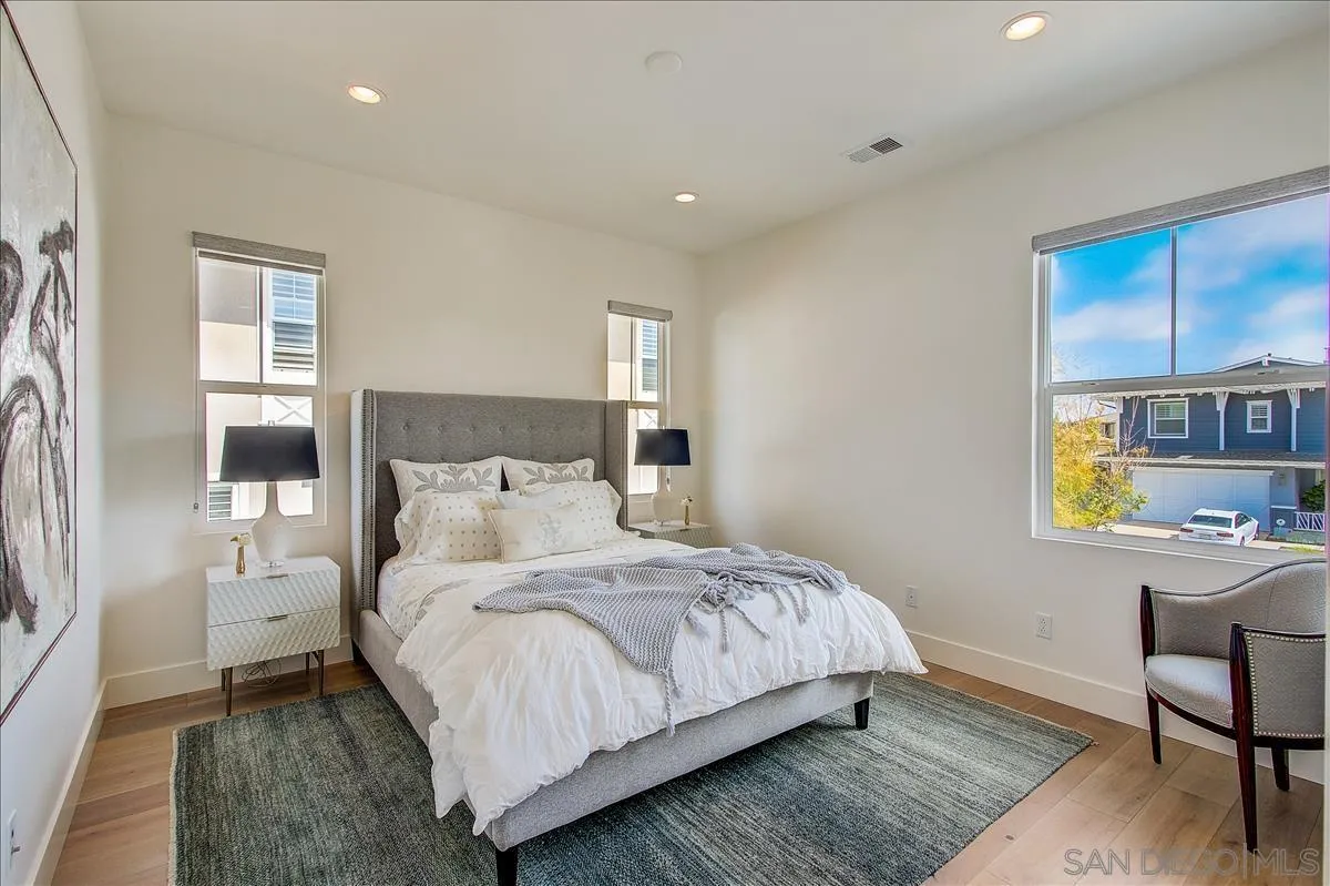 656 Jocelyn Way Encinitas, CA 92024 - Photo 24 of 35 a bedroom with a bed and a window