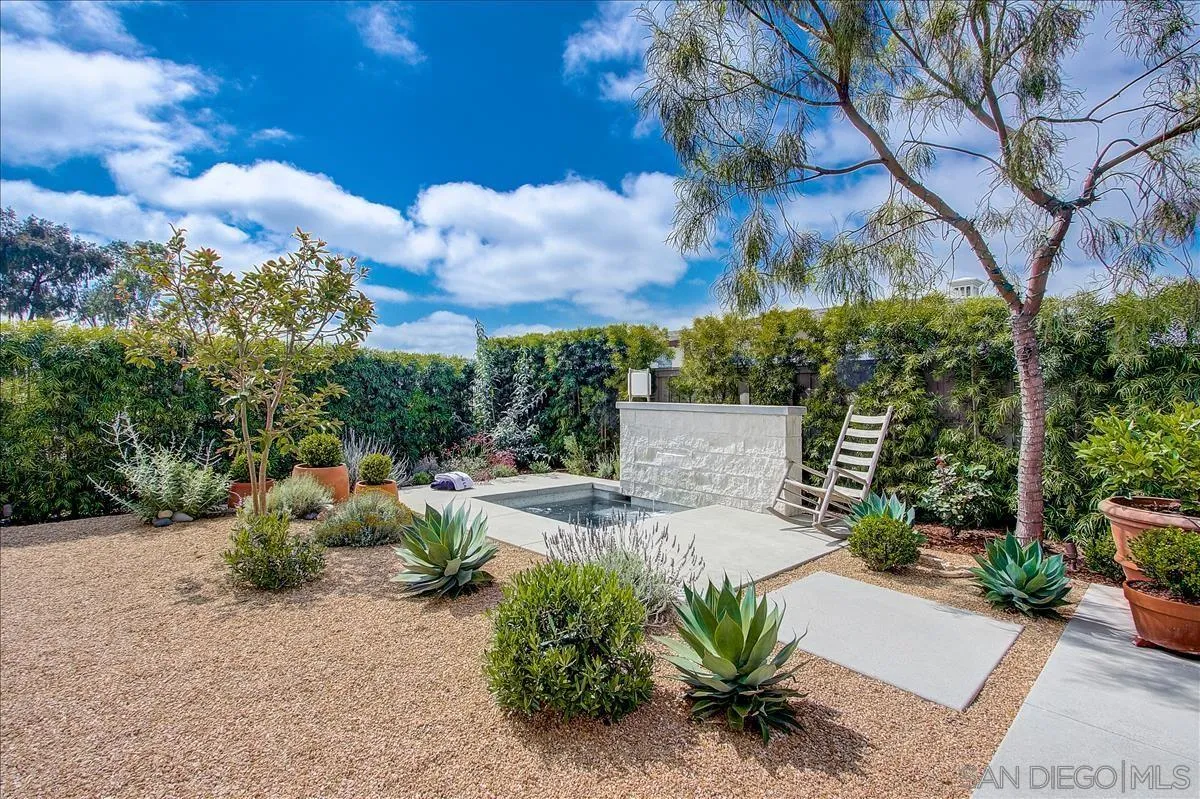 656 Jocelyn Way Encinitas, CA 92024 - Photo 29 of 35 a backyard of a house with table and chairs plants