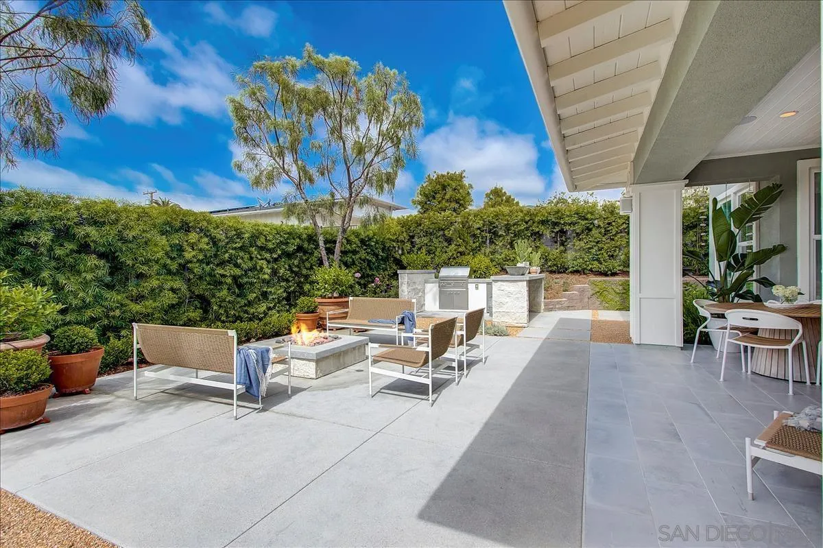 656 Jocelyn Way Encinitas, CA 92024 - Photo 6 of 35 a view of a patio with a table and chairs and potted plants