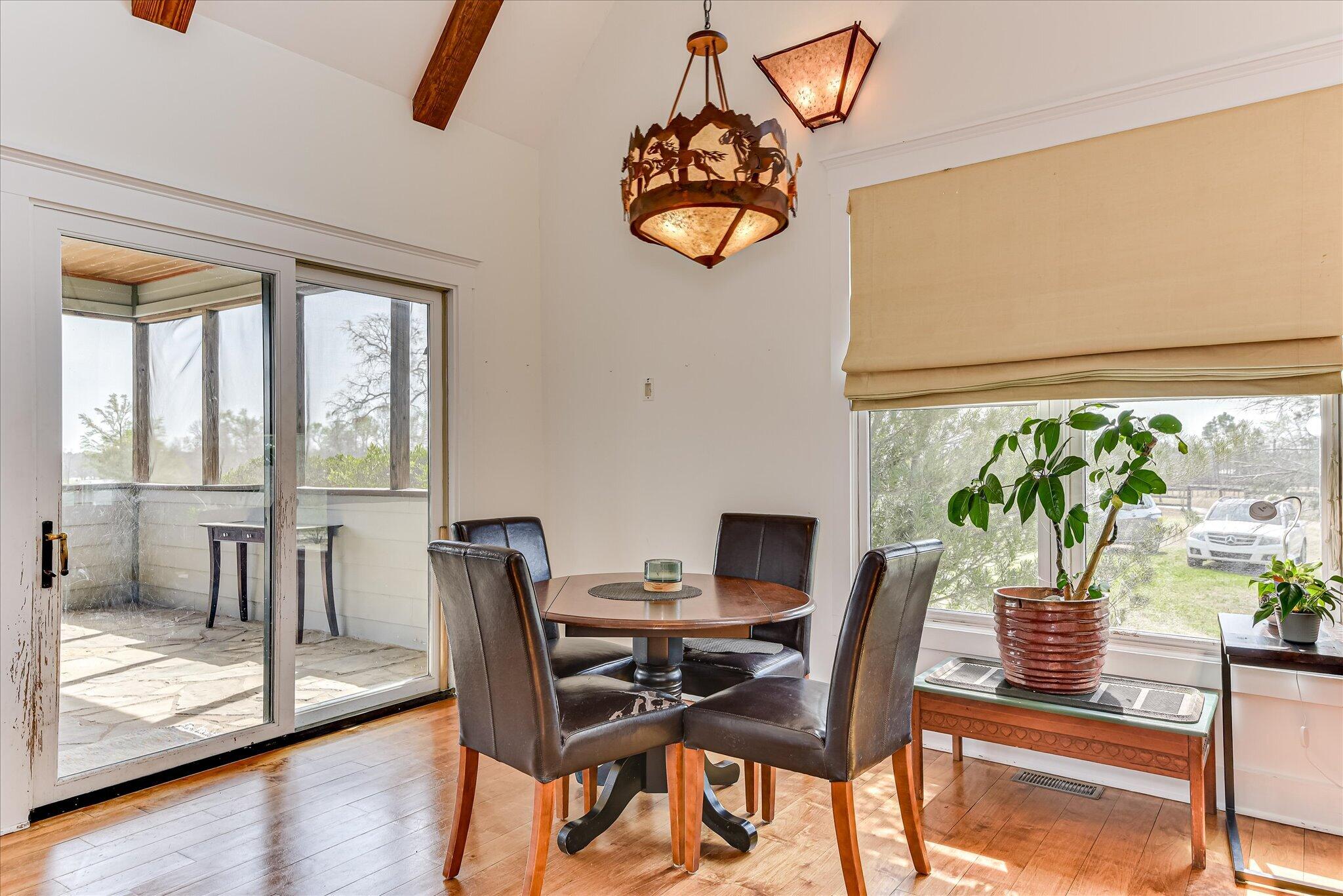 1063 Colbert Bridge Road Aiken, SC 29803 - Photo 11 of 68 a dining room with furniture a window and a table