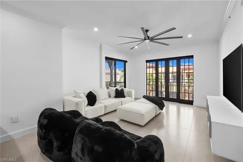 a bedroom with bed and a large window