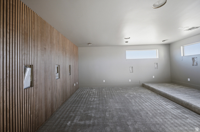 3011 East Rimrunner Drive, Unit 302 St. George, UT 84790 - Photo 30 of 45 Spare room with wooden walls and carpet floors
