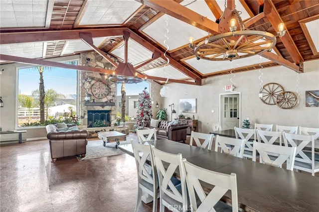 a living room with lots of furniture and a large window