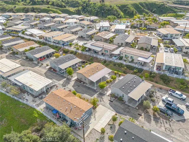 an aerial view of a house with a ocean view