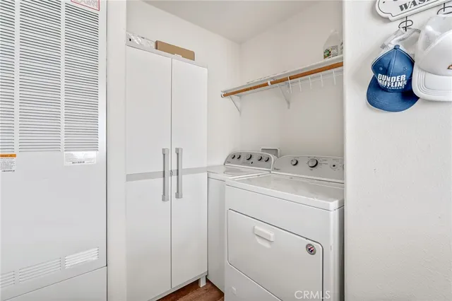 a utility room with closet and window