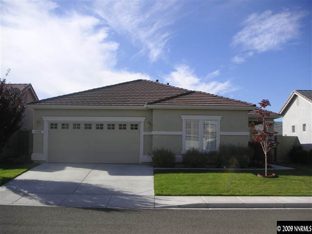 1730 River Gorge Court Reno, NV 89521 - Photo 1 of 9 a front view of a house with garage and plants