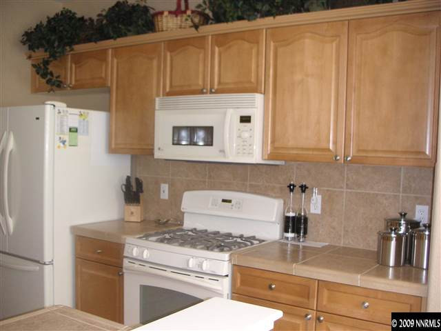 1730 River Gorge Court Reno, NV 89521 - Photo 3 of 9 a kitchen with a stove and a refrigerator