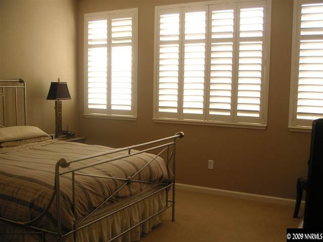 1730 River Gorge Court Reno, NV 89521 - Photo 7 of 9 a bedroom with a bed and a window