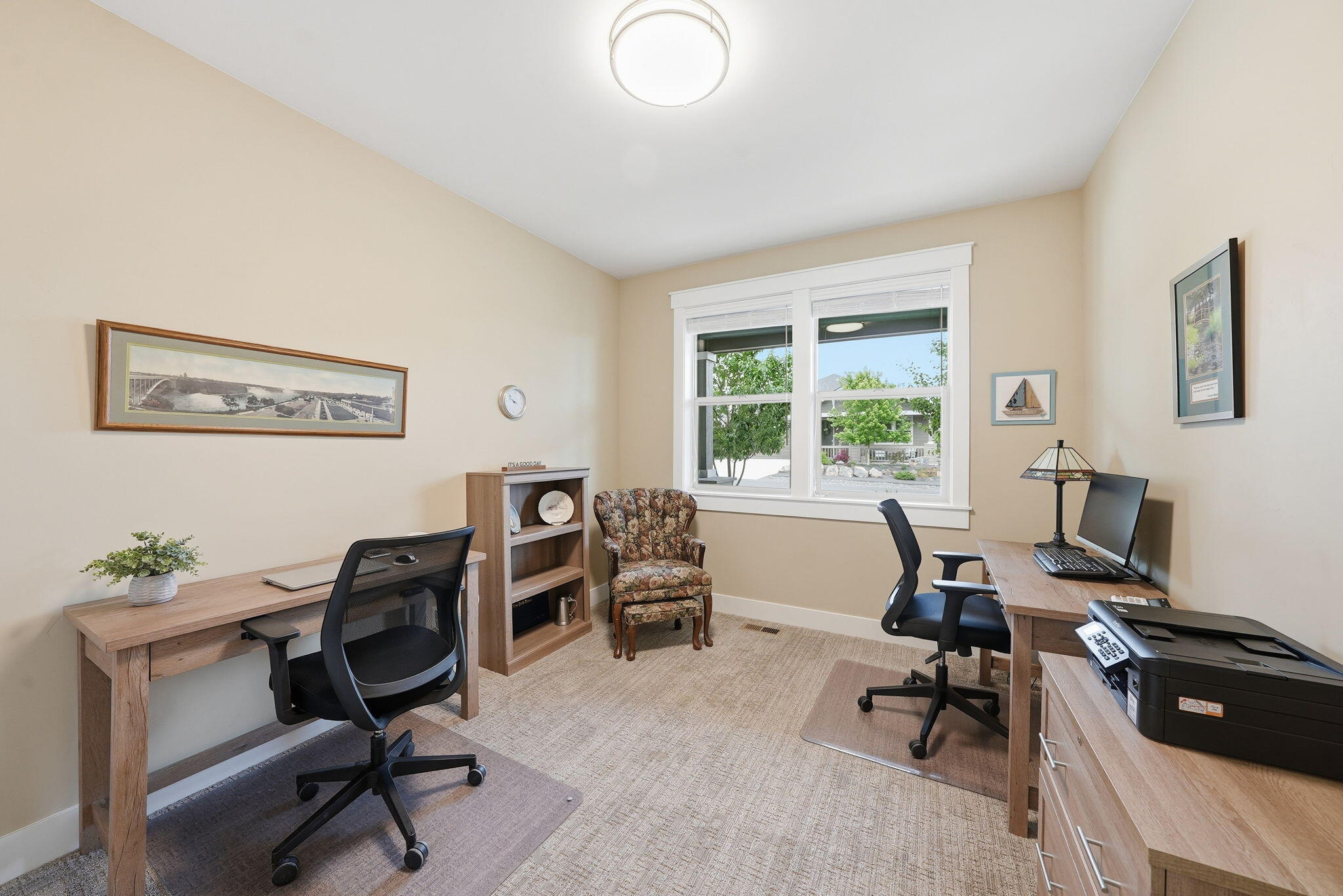 2714 Northwest 23rd Street Redmond, OR 97756 - Photo 26 of 57 a view of a workspace with furniture and a window
