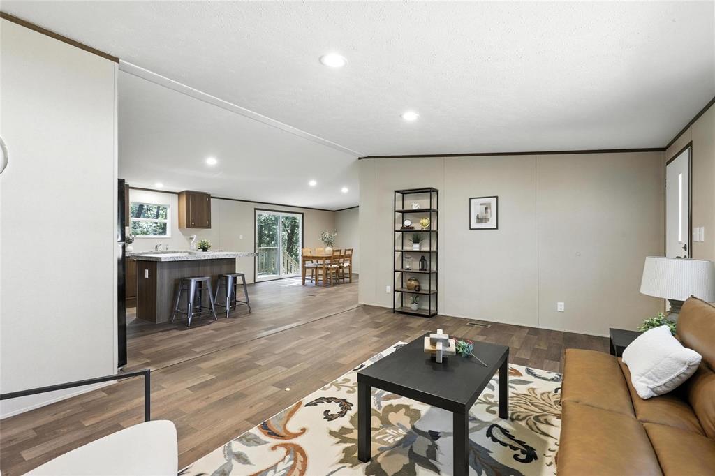 131 Kelly Court Azle, TX 76020 - Photo 5 of 22 a living room with furniture and wooden floor