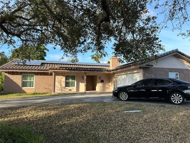 a car parked in front of a house