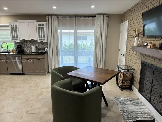 a kitchen with a stove a sink and a refrigerator