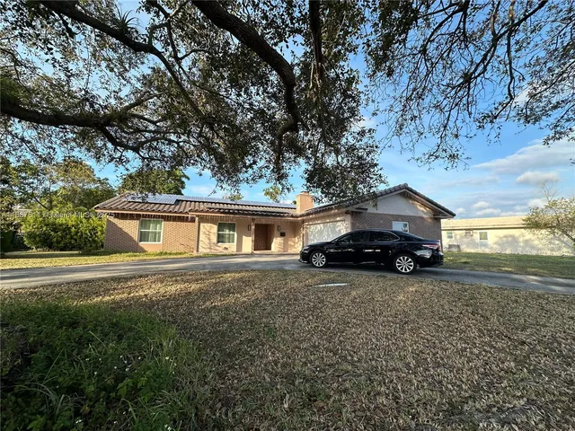 a house view with a garden space