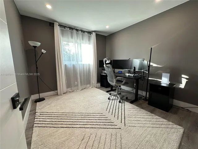 a view of a workspace with furniture