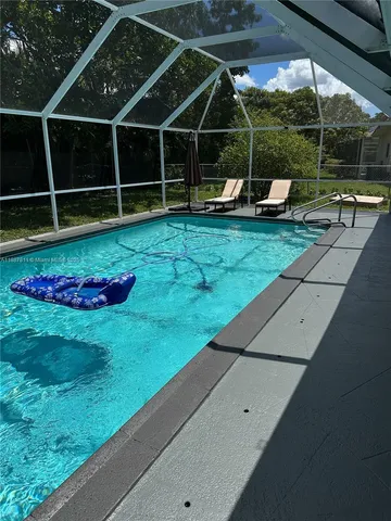 a view of a house with a yard and porch